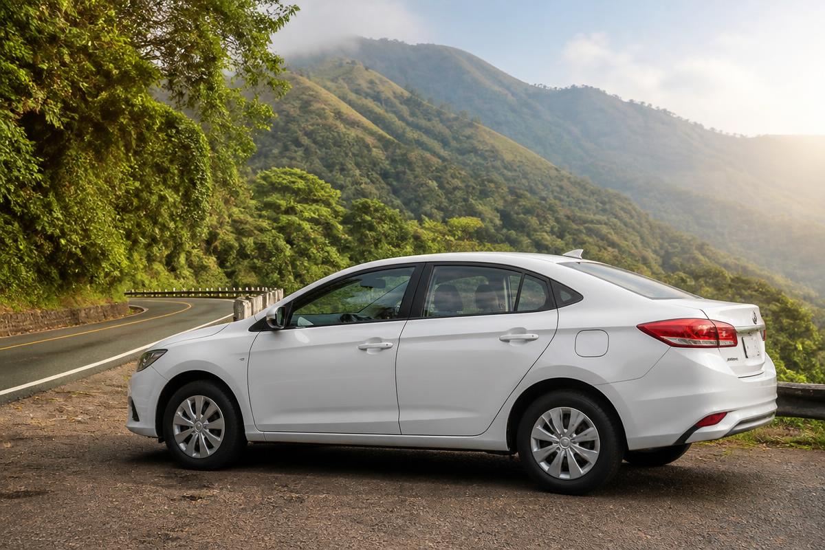 White rental sedan on a scenic hill road